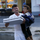 Image for article titled Photos: Hero Slovenian waiter delivers pizza to hungry migrant kids